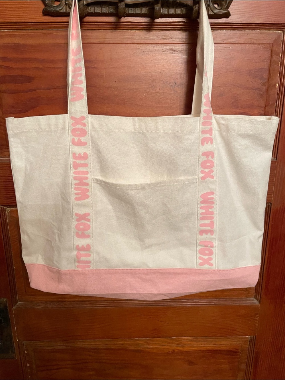 white and pink canvas tote bag